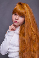 Fototapeta premium Little red haired girl background isolated