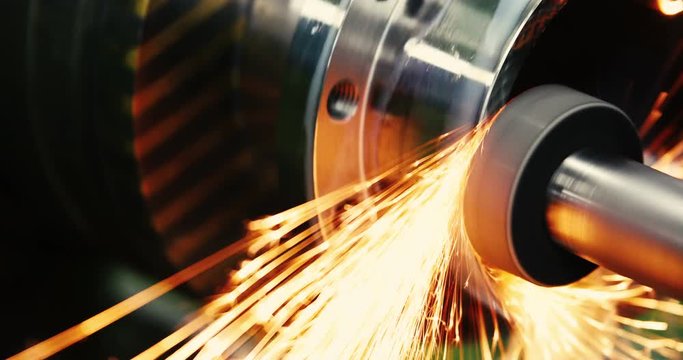 sparks flying while machine griding and finishing metal