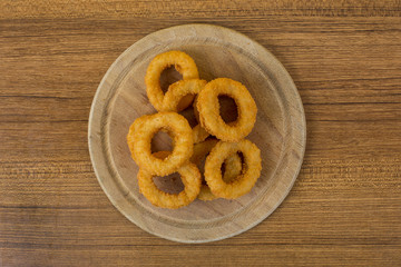 Onion Rings on Wood Board
