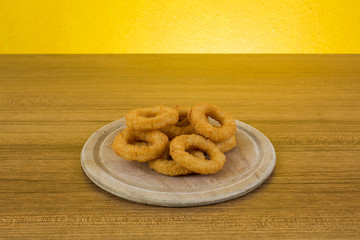 Onion Rings on Wood Board
