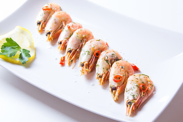 Shrimps fried with garlic and chili. Close-up, selective focus.