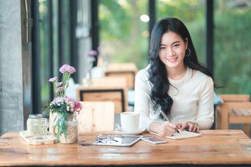Asian girl working in coffee shop cafe
