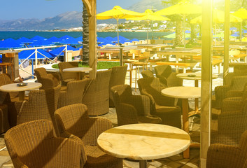 bright Sunny day on the beach in an empty café near the beach, Greece, Crete