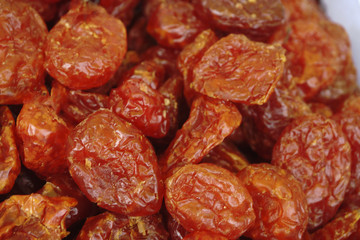 A fresh date-palm and dry date-palm on a wooden trays in the market vintage style.