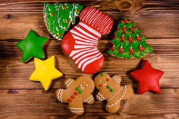 Different christmas gingerbread cookies on wooden table. Top view