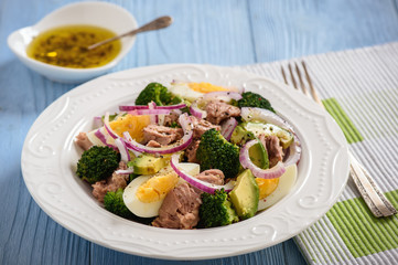 Healthy salad with tuna, eggs and broccoli.