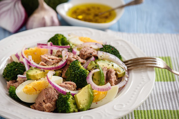Healthy salad with tuna, eggs and broccoli.