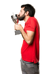 Handsome man holding a trophy