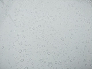 drops of water on glass  background,wet floor and raindrop on hood