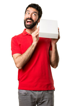 Surprised Handsome man holding a box