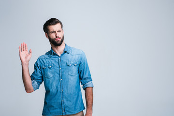 Oh so smelly! Handsome young man feeling bad smell and looking frustrated while standing against white background