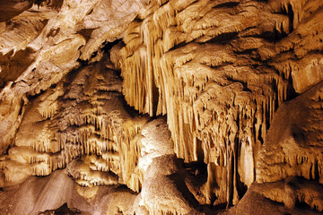 Wonderful columns of stalactites looking like water falls inside the cave of Antiparos, an amazing...