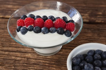 Fruit ice cream and blueberry on wooden table
