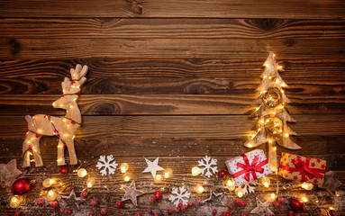 Christmas background with wooden decorations,moose and tree