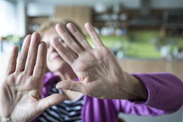 old woman with stop gesture - selective focus on hands - obrazy, fototapety, plakaty