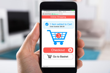 Person Shopping Online Using Smartphone