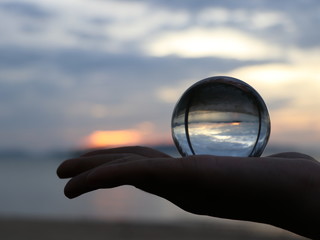 Crystal ball holding in hand