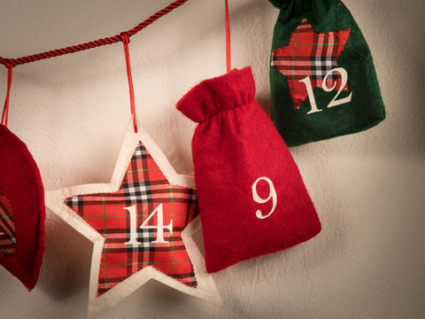 An advent calendar made of bags hanging on a string