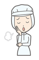 A female worker wearing white sanitary clothing is sighing