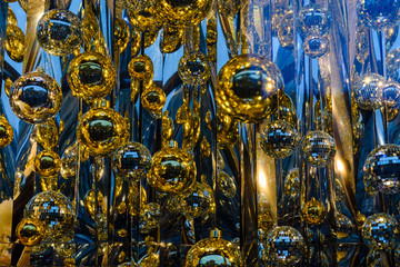 Different christmas decorations in showcase of the shop