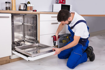 Technician Repairing Dishwasher