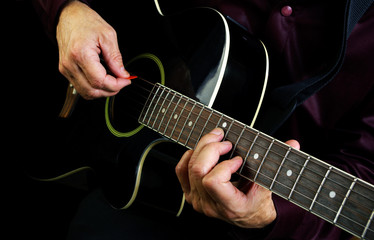 Playing an Acoustic Guitar. 
