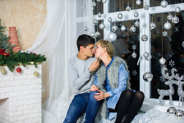 Beautiful couple in love on a Christmas, having a rest on Christmas holidays before the new year 