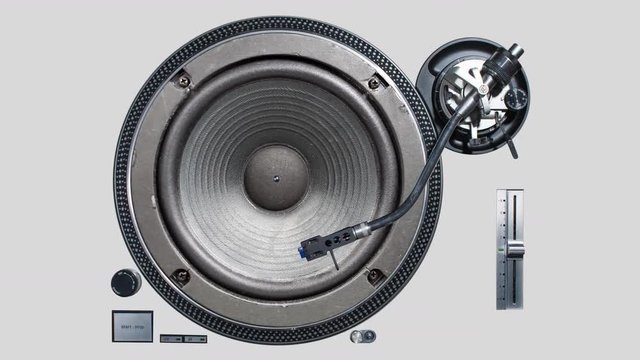 a cutout of a vinyl record player with a video of a pumping speaker in the middle of the plate