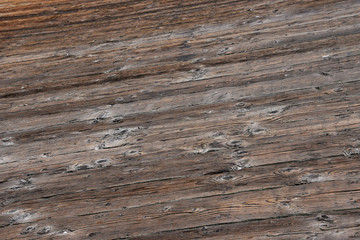 Fototapeta premium Aged worn timber boards from a pier - background texure