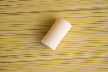 paccheri on a background of spaghetti