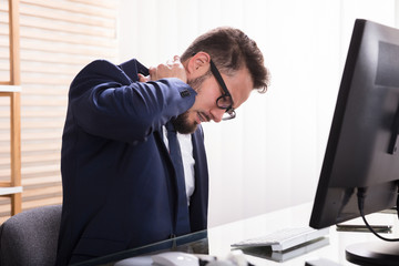 Businessman Suffering From Neckache