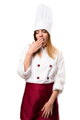 Beautiful chef woman yawning