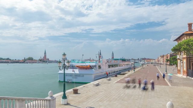 View of the promenade Riva degli Schiavoni timelapse with tourists in San Marco of Venice in Italy.