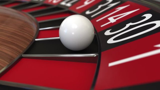 Casino roulette wheel ball hits 30 thirty black