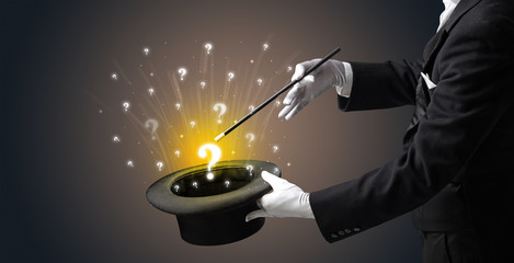 Magician conjure question signs from a cylinder © ra2 studio