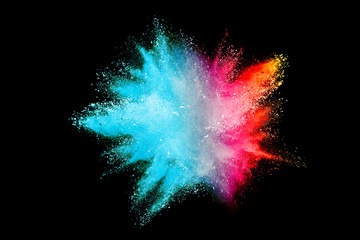 Splash of colorful powder over black background.