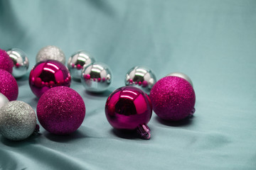 Red and silver Christmas decorations on crimson background