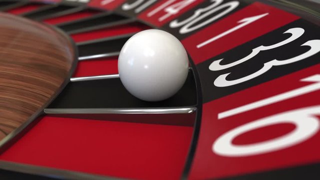 Casino roulette wheel ball hits 33 thirty-three black