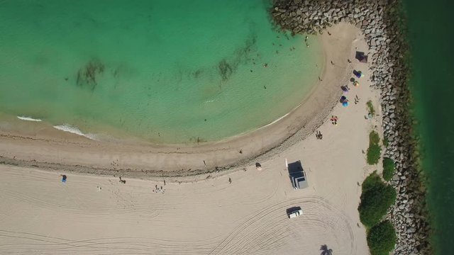 Top view Aerial footage of the morning Haulover Beach, Miami, Florida. The camera moves down. 4K Ultra HD