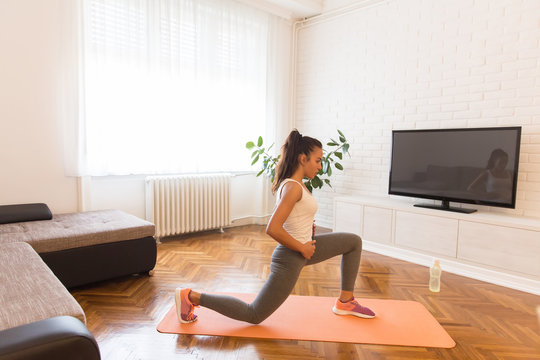 Fit young woman exsercise in the room