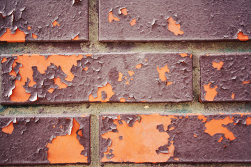 Brick texture photo. Old cracked paint. Close up. Weathered brick wall. For background or backdrop. Dry peeling paint.