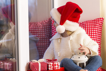 Happy Little girl waiting for Christmas.