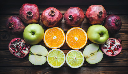 Vitamins for immunity. Fresh fruits. Oranges, apples, pomegranates, lemons.
