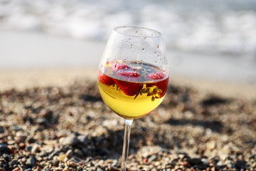 Frozen strawberry sangria cocktail at the edge of the sea.
