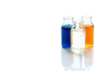 chemical vessels with colorfull liquids on white background