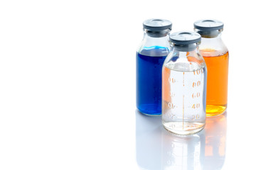 chemical vessels with colorfull liquids on white background