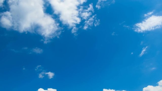 Clouds are moving in the blue sky. TimeLapse. Beautiful White fluffy clouds over blue sky soar in Time lapse.