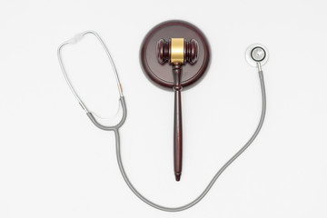 Stethoscope with judge gavel. Concept of healthcare and medicine, malpractice, legal system.