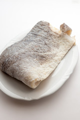 Slice of raw salted codfish
