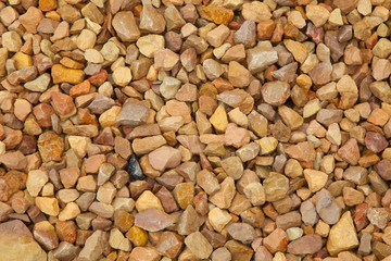 gravel stones texture background, yellow shades